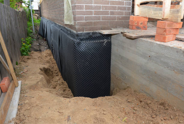 SJ Waterproofing Pros technician performing targeted Sump Pump Installation assessment in Copiague, NY